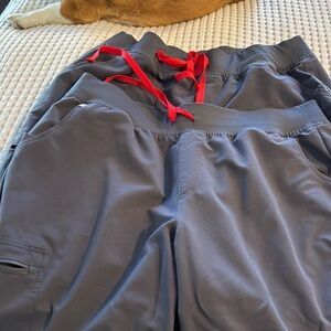 2 pair of charcoal colored figs bottoms